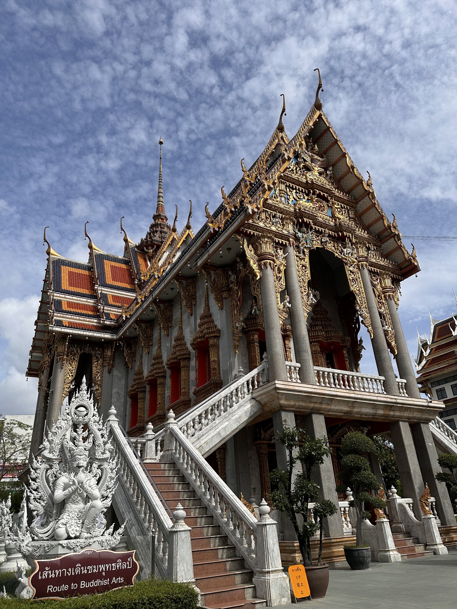 Steps rising to an ornate temple entrance.