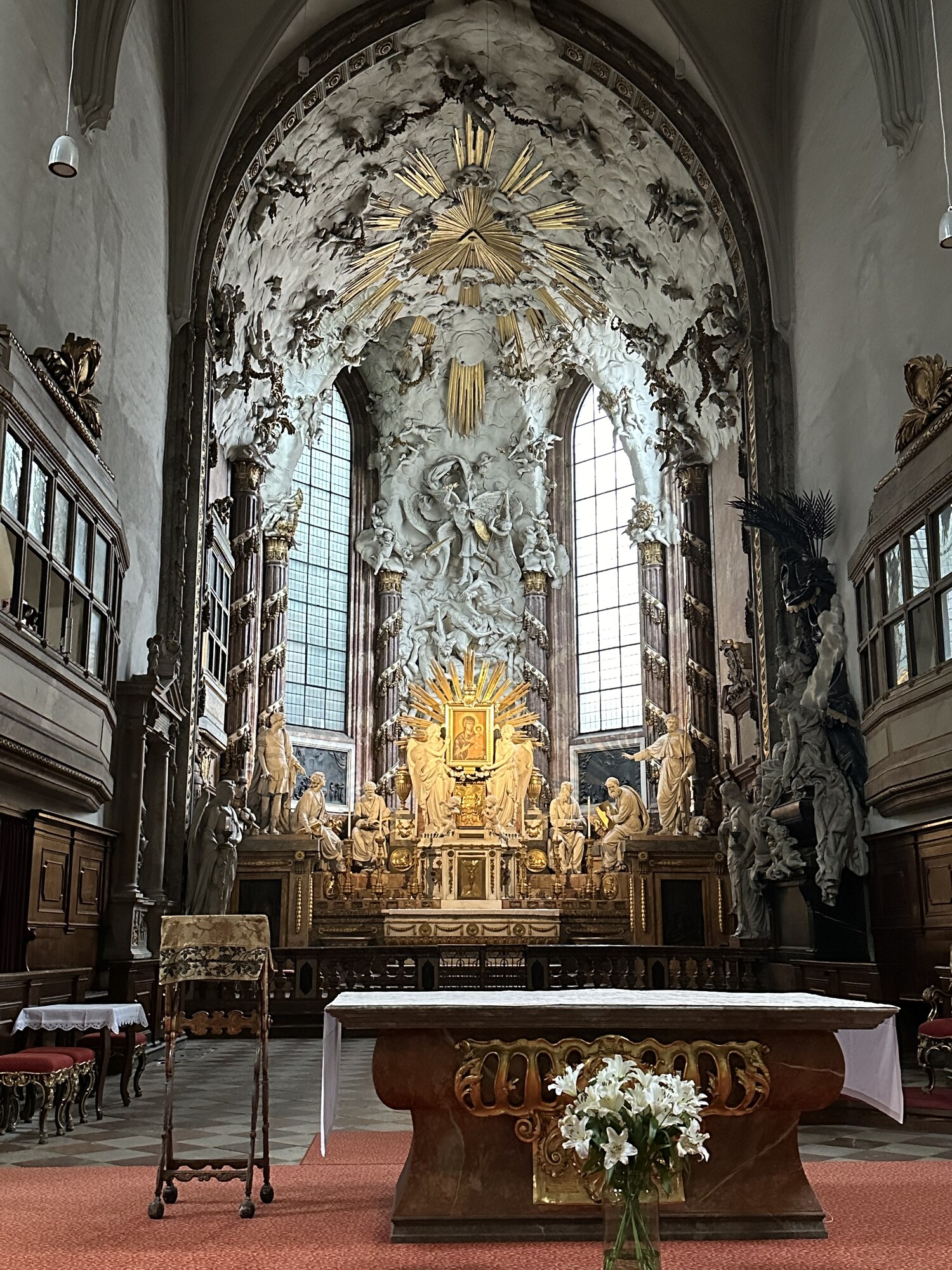 White and gold details surrounding an altar.