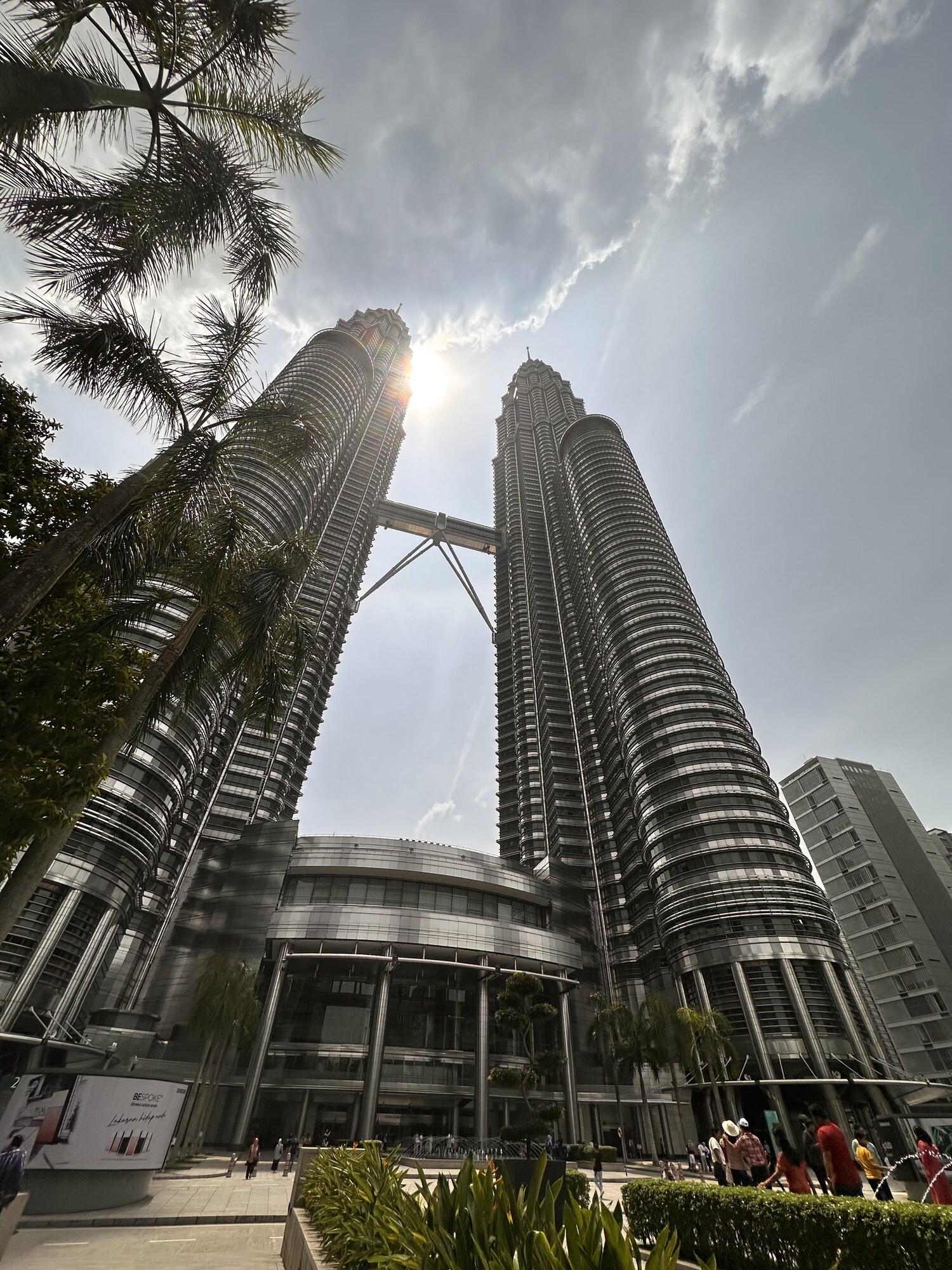 Two towers rising toward a bright sky.